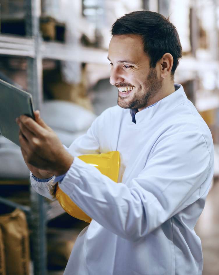 construction worker looking at a tablet device