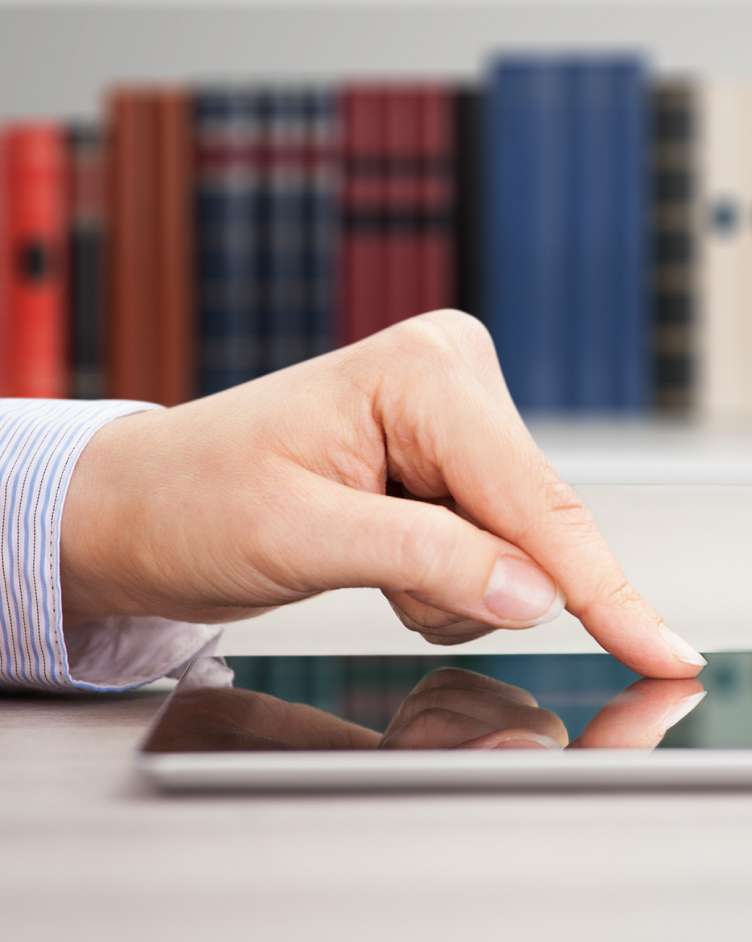finger touching ipad