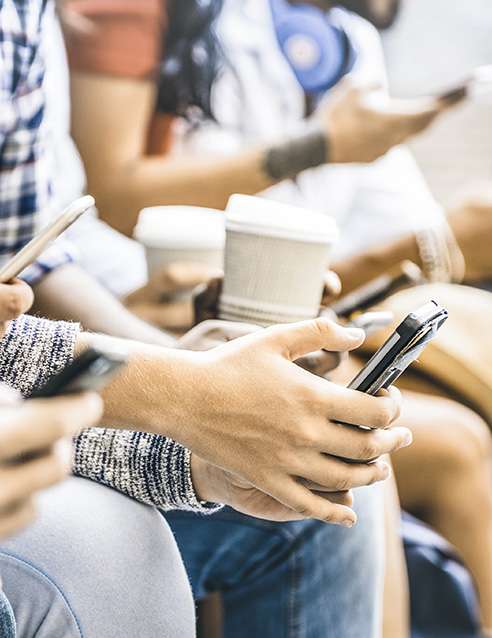 multiple people on their phones