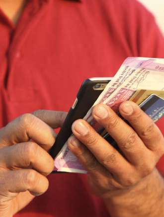 man with phone and money